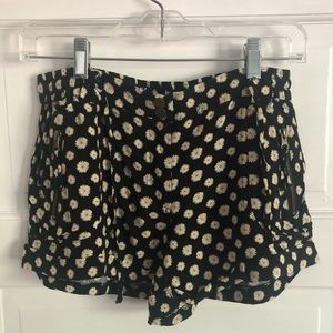 Black shorts with sunflowers